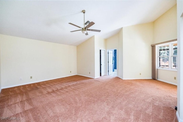 unfurnished living room featuring light carpet, high vaulted ceiling, and ceiling fan