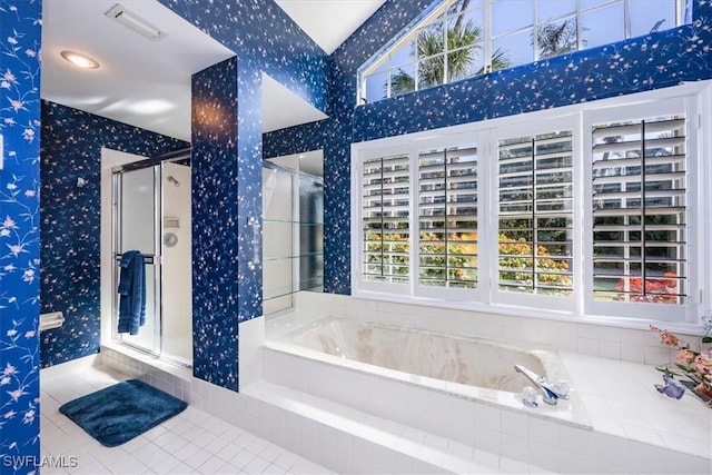 bathroom with separate shower and tub, plenty of natural light, and tile patterned flooring