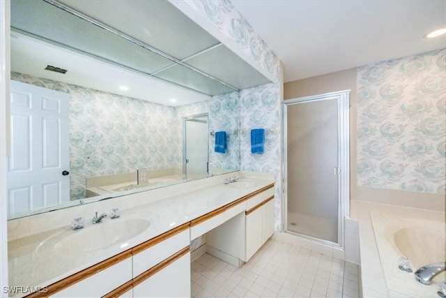 bathroom featuring tile patterned flooring, vanity, and independent shower and bath