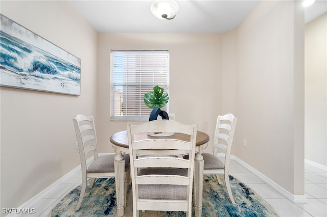 dining area with light tile patterned flooring