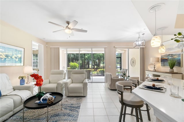 living room featuring ceiling fan and light tile patterned floors