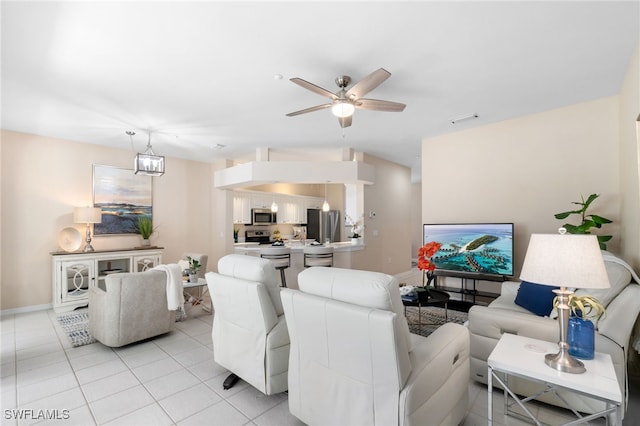 tiled living room with ceiling fan