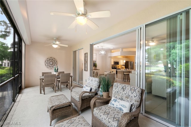 sunroom / solarium with ceiling fan