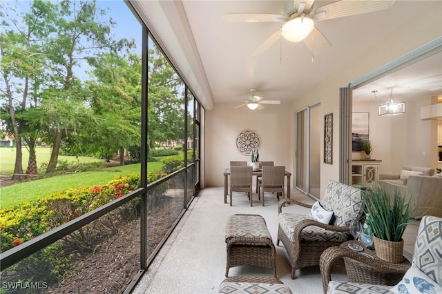 sunroom / solarium with ceiling fan