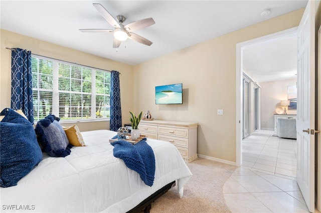 tiled bedroom with ceiling fan