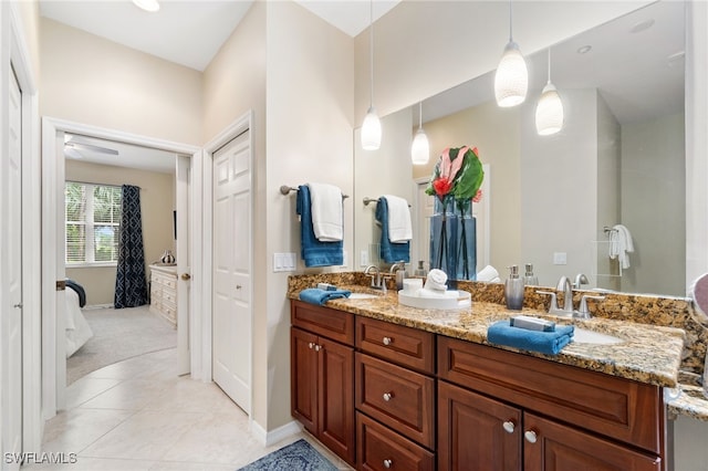 bathroom featuring tile patterned flooring, vanity, and ceiling fan