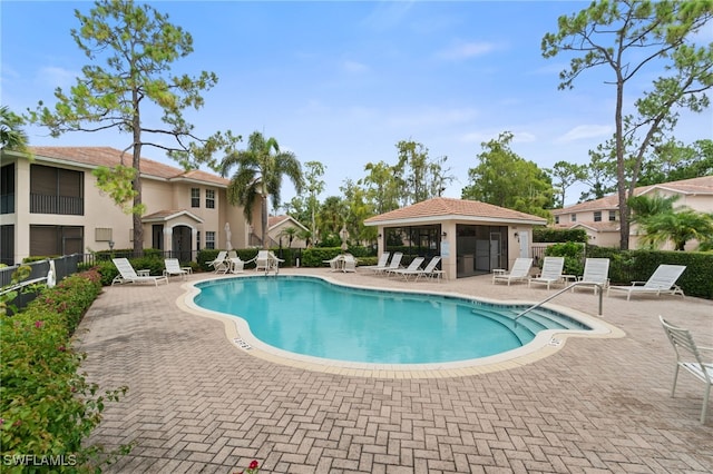 view of swimming pool with a patio