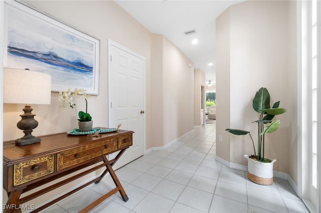 corridor featuring light tile patterned floors