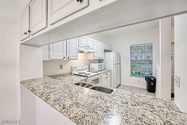 kitchen featuring white cabinetry, sink, light tile patterned floors, light stone countertops, and white appliances