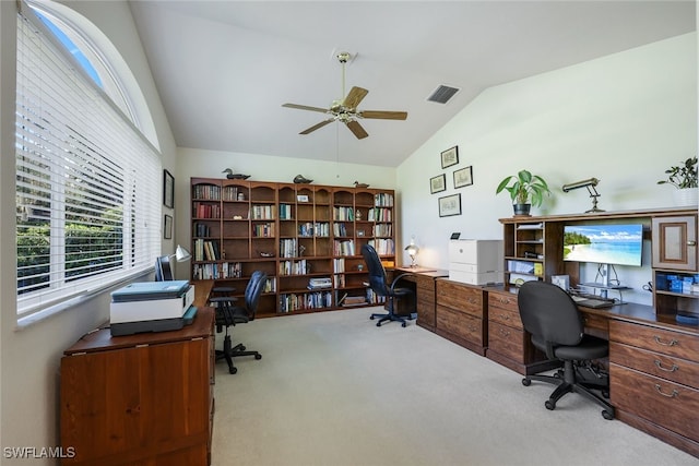 carpeted office space featuring ceiling fan and lofted ceiling