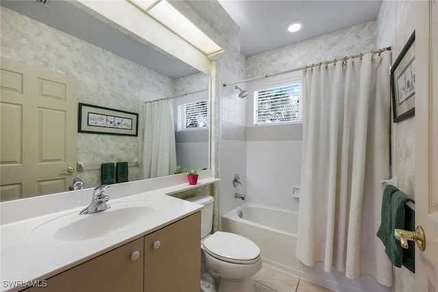 full bathroom featuring tile patterned floors, shower / bath combo, toilet, and vanity