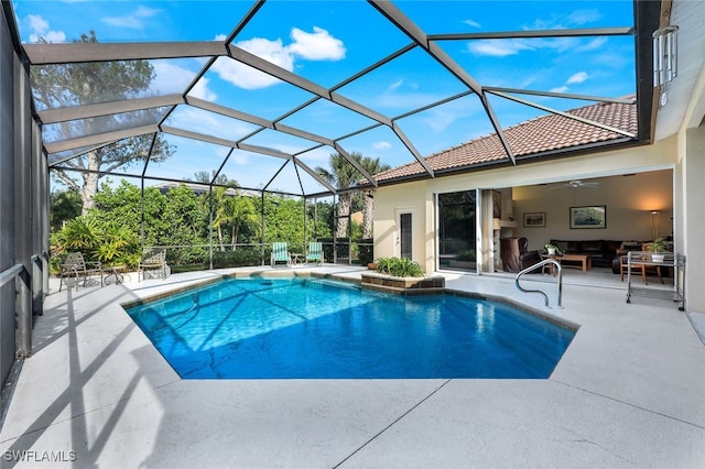 view of swimming pool with a lanai, ceiling fan, a patio, and an outdoor hangout area