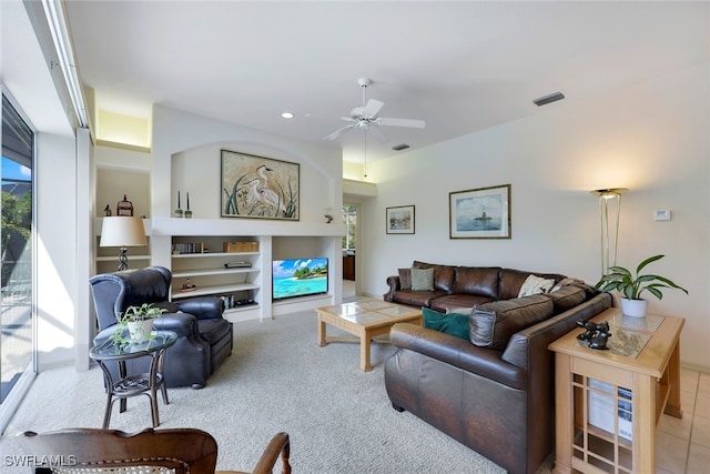 living room with ceiling fan and light carpet