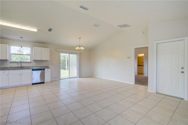 kitchen featuring dishwasher, white cabinetry, light tile patterned floors, pendant lighting, and lofted ceiling