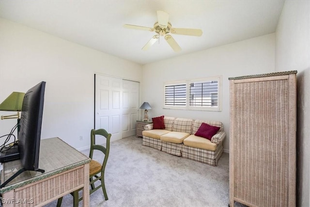 carpeted office with ceiling fan