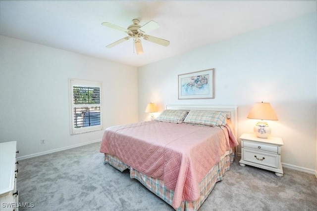 bedroom featuring ceiling fan and light carpet