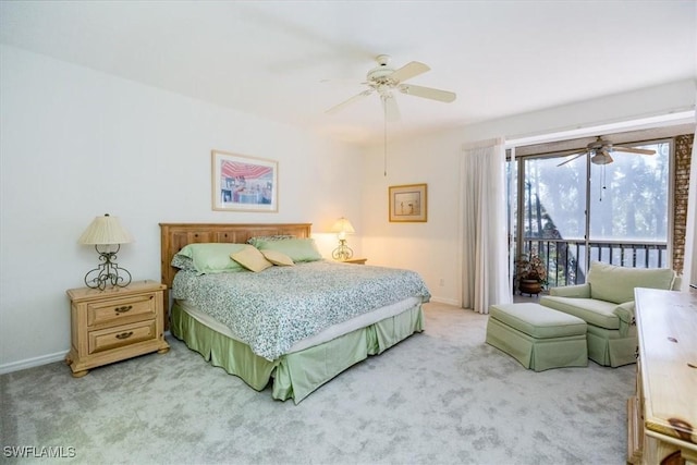 bedroom with ceiling fan, access to exterior, and light carpet