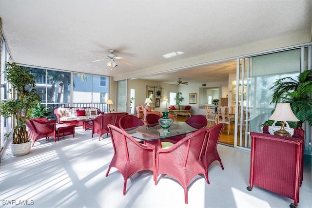 dining room featuring a textured ceiling and ceiling fan