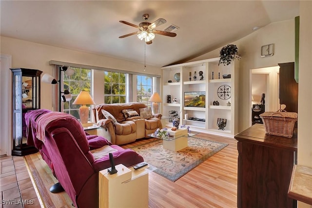 living room with light wood-type flooring, ceiling fan, and lofted ceiling