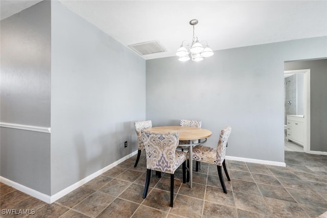 dining space featuring an inviting chandelier