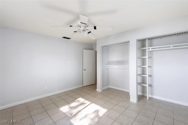 unfurnished bedroom with light tile patterned floors and ceiling fan