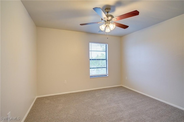 spare room with carpet floors and ceiling fan