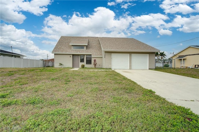 view of front of house with a garage and a front lawn