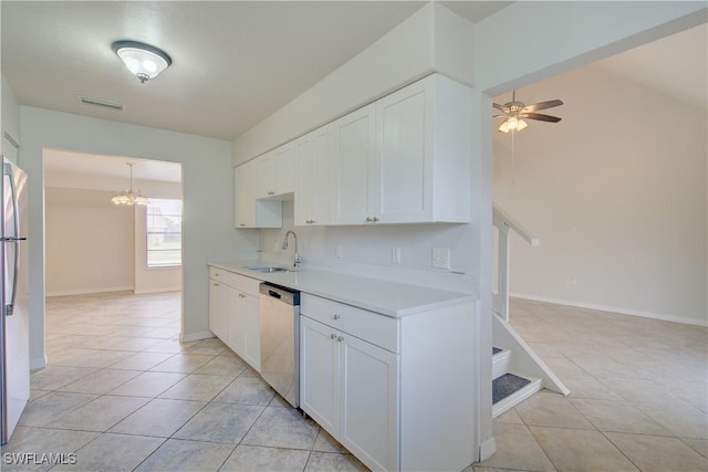 kitchen featuring sink, white cabinets, light tile patterned floors, and stainless steel appliances