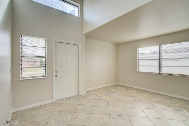 foyer entrance featuring plenty of natural light and light tile patterned floors