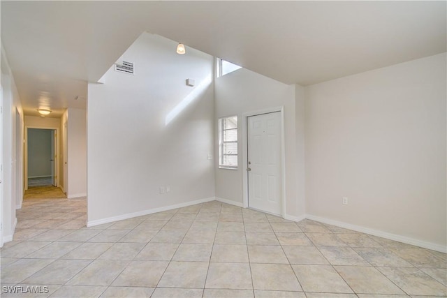 unfurnished room featuring light tile patterned floors