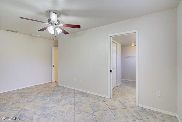 spare room with ceiling fan