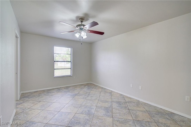 unfurnished room featuring ceiling fan and light tile patterned flooring