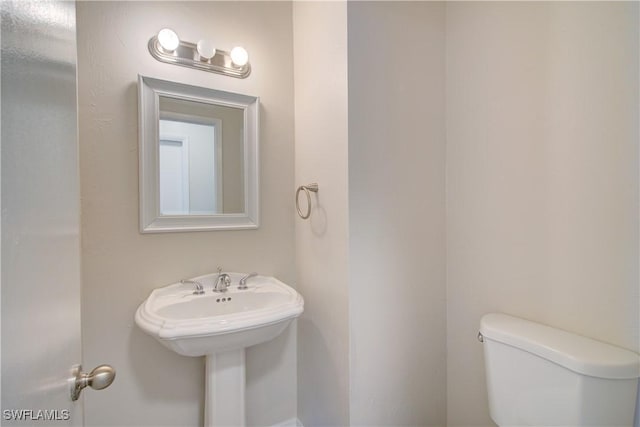 bathroom featuring toilet