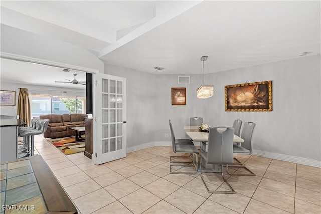 tiled dining space with french doors and ceiling fan