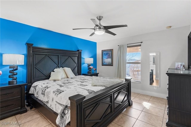 bedroom with ceiling fan and light tile patterned flooring