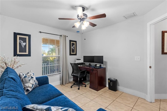 tiled office featuring ceiling fan