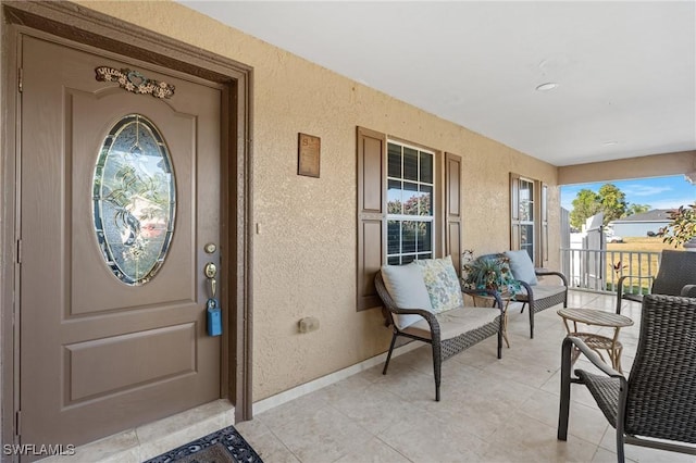 entrance to property featuring a porch