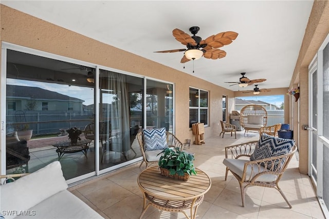 exterior space featuring ceiling fan