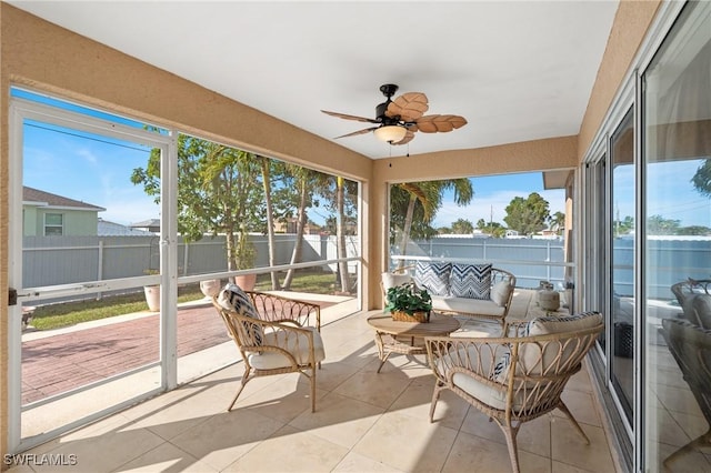 sunroom / solarium with ceiling fan