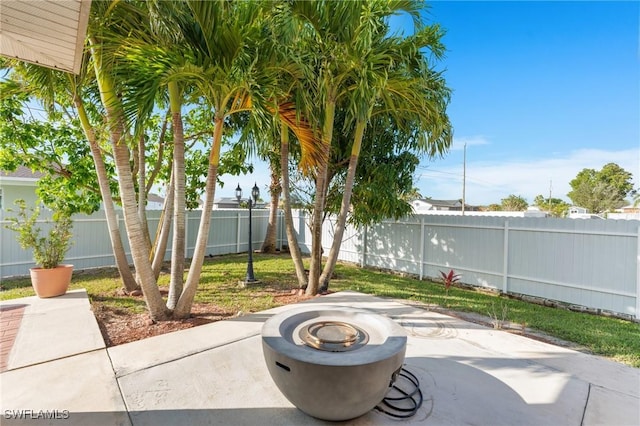 view of patio / terrace featuring a fire pit