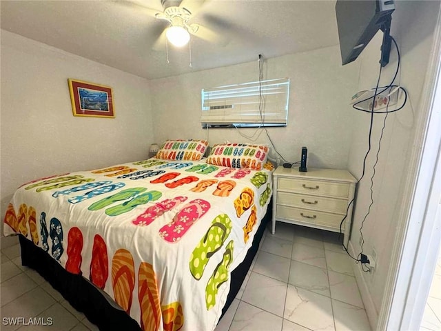 bedroom with a ceiling fan and marble finish floor