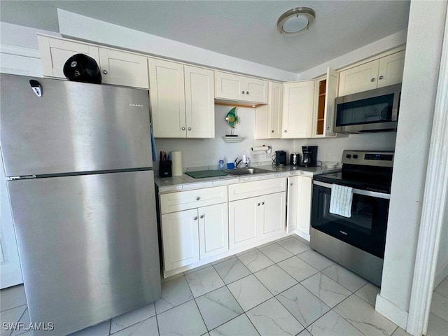 kitchen with appliances with stainless steel finishes and sink