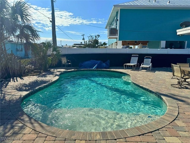 view of pool featuring a patio area