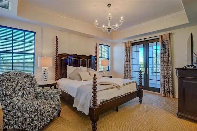 bedroom with a notable chandelier, a raised ceiling, crown molding, light carpet, and french doors