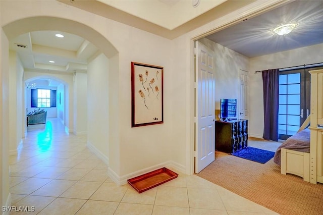 hall with light tile patterned floors and french doors