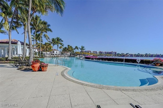 view of swimming pool with a patio area