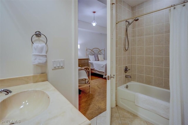 bathroom with tile patterned flooring, sink, and shower / bath combo