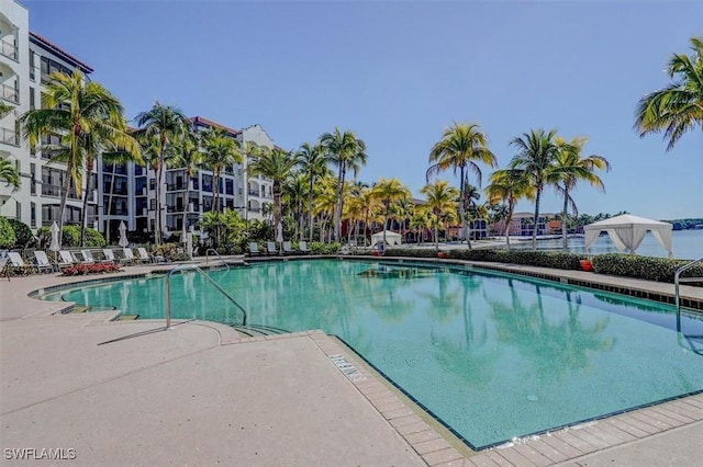 view of swimming pool with a patio