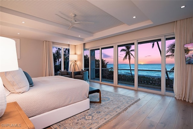 bedroom featuring light wood-type flooring, access to outside, and ceiling fan