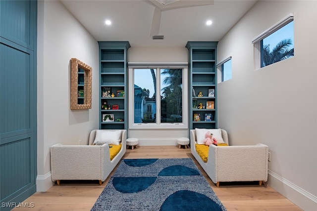 living area with light hardwood / wood-style flooring